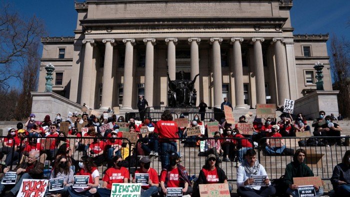 Students stage a walk-out protest at Columbia University’s Low Library steps