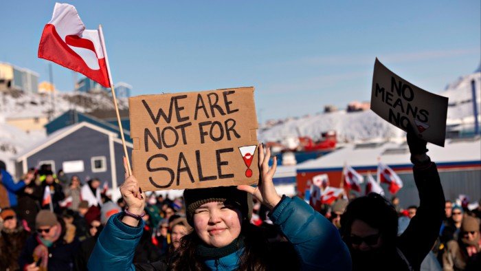 People take part in a march ending in front of the US consulate, under the slogan, Greenland belongs to the Greenlandic people, in Nuuk.