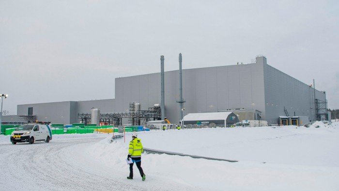 A worker walks at the site of the Northvolt Ett factory