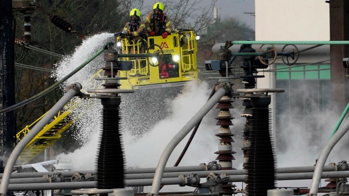 Firefighters extinguish the fire at the North Hyde electrical substation