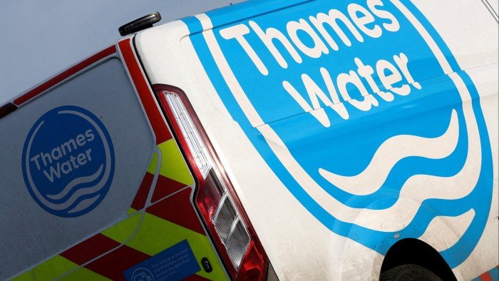A Thames Water sign on the back of one of its vehicles