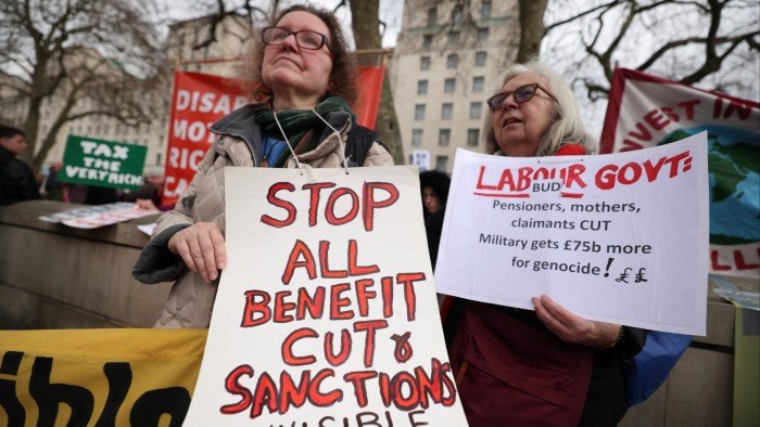 Protesters demonstrate outside Downing Street against disability and welfare cuts during the Spring Statement on Wednesday