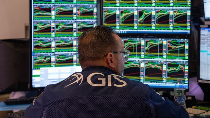 Trader at a screen looking at stick prices