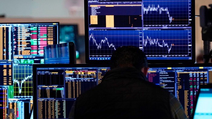 A trader works on the floor of the New York Stock Exchange on Tuesday, March 11 2025