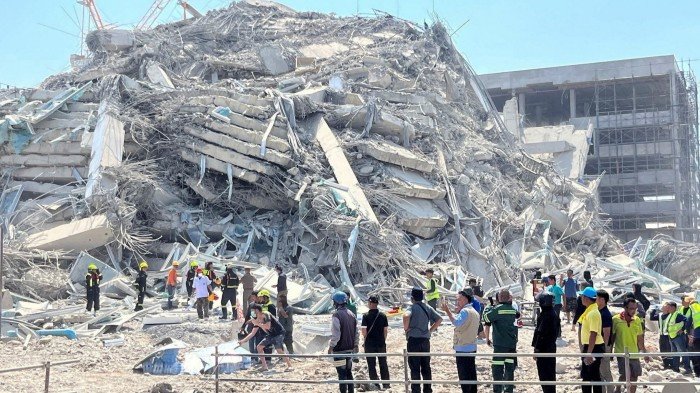 Rescuers work at the site of a collapsed building in Bangkok, Thailand after an earthquake struck neighbouring Myanmar on Friday