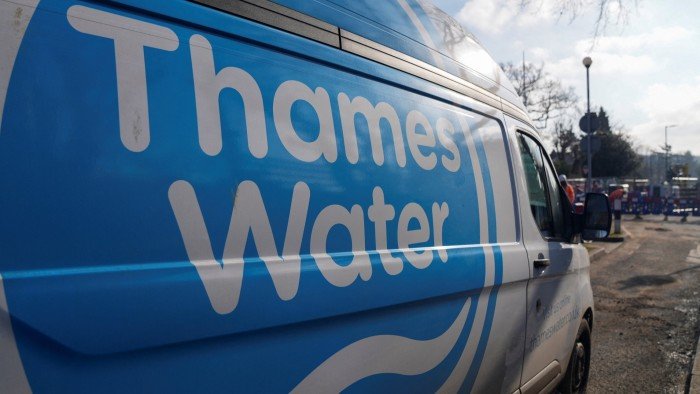 A Thames Water van is parked on a street in London, with the company's logo prominently displayed on its side
