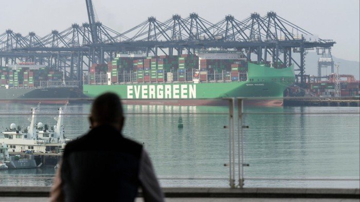 Gantry cranes and container ships at the Yantian International Container Terminals in Shenzhen, China