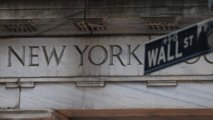 Wall Street sign and entrance to the New York Stock Exchange