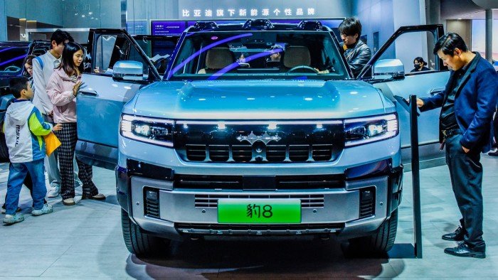 Visitors view a BYD Leopard 8 at the 2024 ASEAN International Auto Show in China