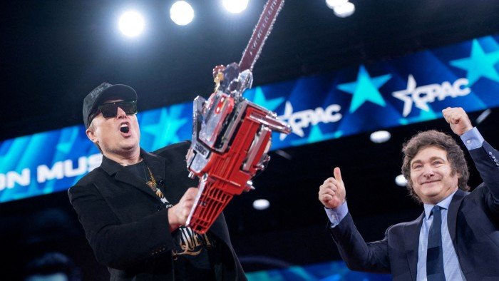 Elon Musk displays a chainsaw given to him by Argentine President Javier Milei during the Conservative Political Action Conference in Maryland, US on February 20 2025
