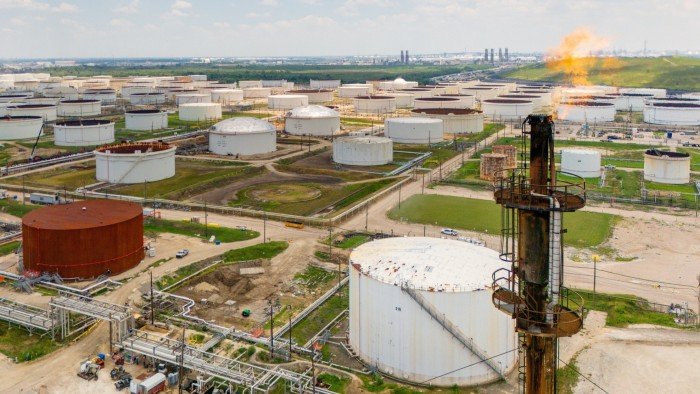 Aerial view of numerous large oil storage containers at a Chevron refinery in Pasadena, Texas