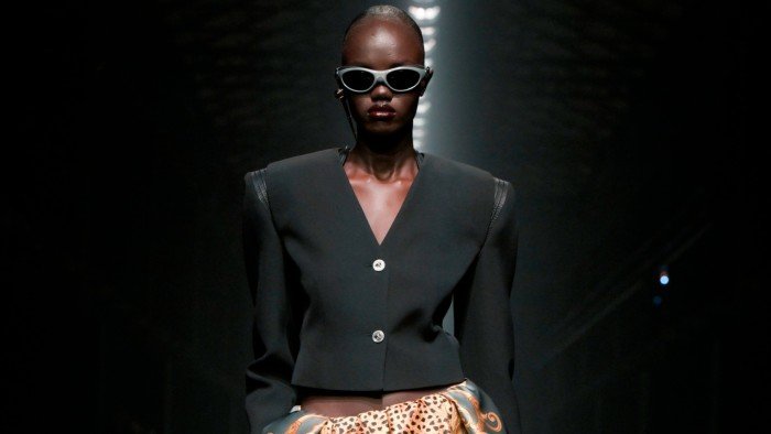 A Versace model on the runway during Milan Fashion Week in February